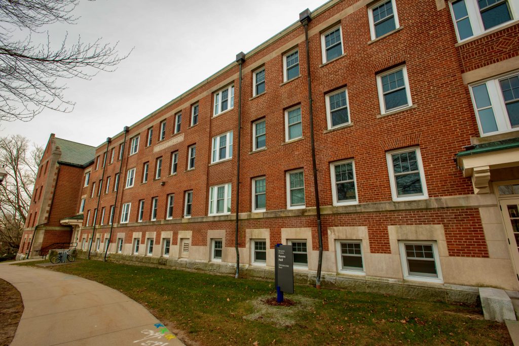 Exterior of Koons Hall, where one of the Ryberg Lab spaces is located. The building has 3 floors, a red brick exterior, and tens of windows stretching the length of the building.