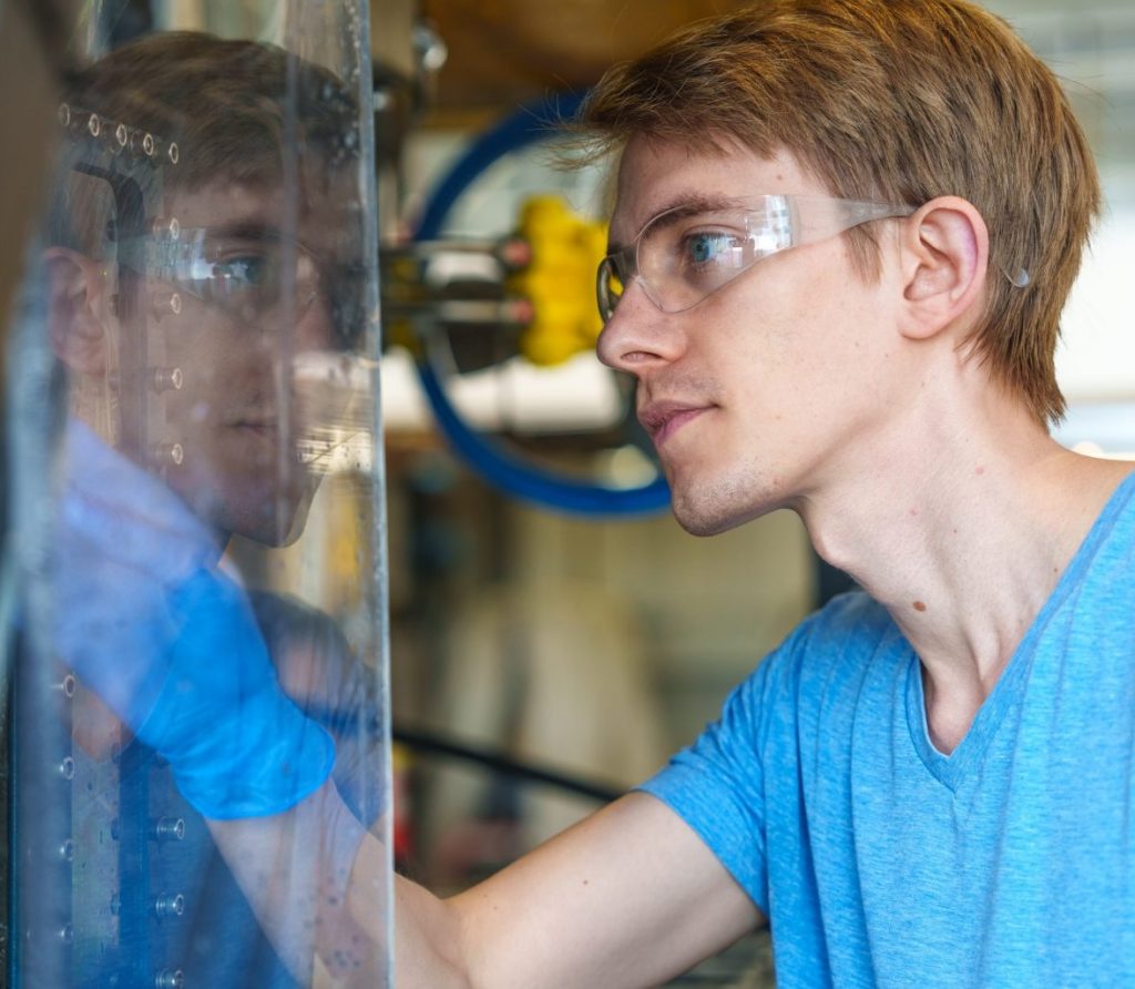 Eric Ryberg inspects sensors on ROV SuBastian following a dive.